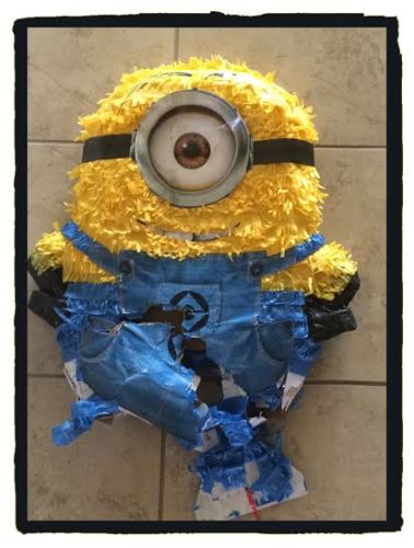 It’s probably hard to tell, but this mangled mess of Minion is the piñata we beat the crap out of, not the disastrous cake I had made.